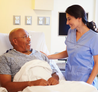 nurse talking to elderly patient